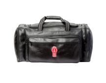 GENUINE KENWORTH Merchandise premium leather look overnight bag with bug logo and "KENWORTH" name. Part No C-KEN385